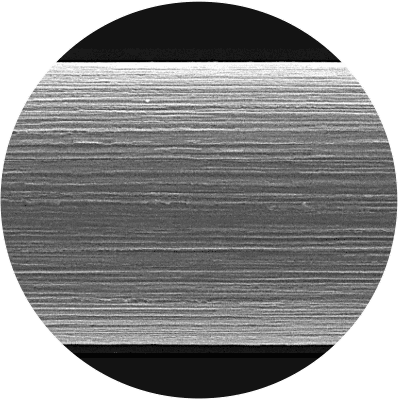 Close-up of the edged surface of an ultra-thin precision wire engineered by Luma Wire Tech for high-performance applications.